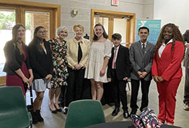  A group of students standing around two women in the middle including Congresswoman Kay Granger